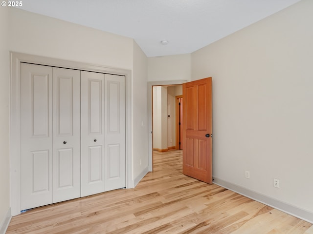 1466 NE 15th Ave, Canby, OR 97013 - unfurnished bedroom featuring light wood-style floors and a closet