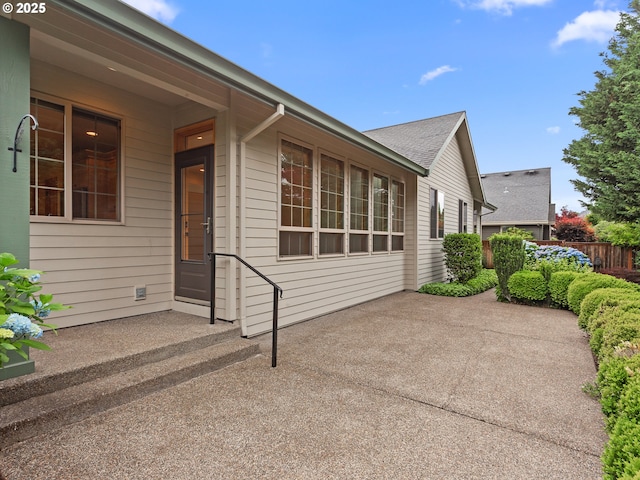 1466 NE 15th Ave, Canby, OR 97013 - view of side of home featuring a patio area and roof with shingles