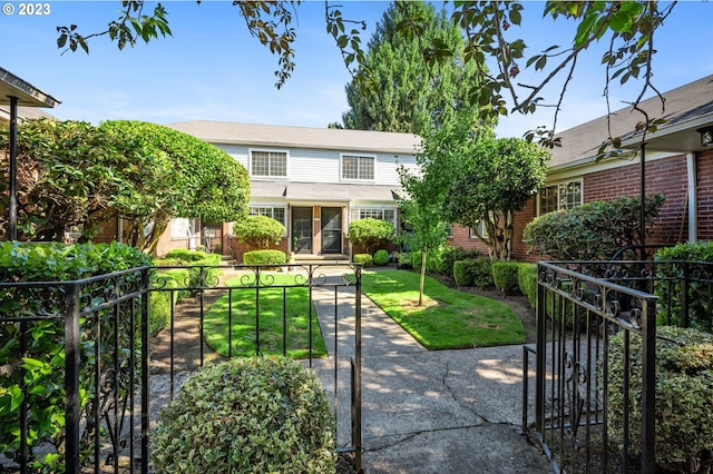 view of front of property with a front lawn