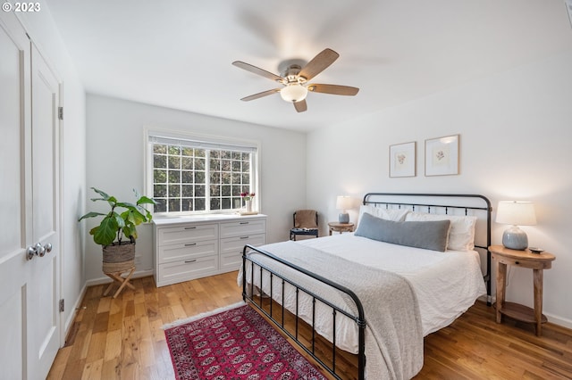 bedroom featuring ceiling fan and light hardwood / wood-style floors