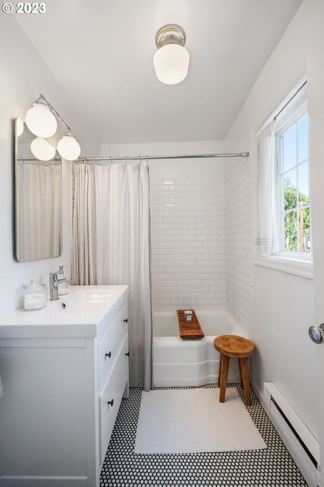 bathroom with tile patterned flooring, shower / bath combo, a baseboard heating unit, and vanity