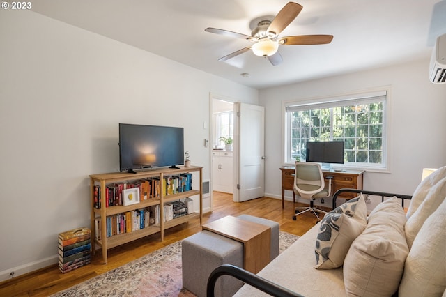 office with hardwood / wood-style flooring and ceiling fan