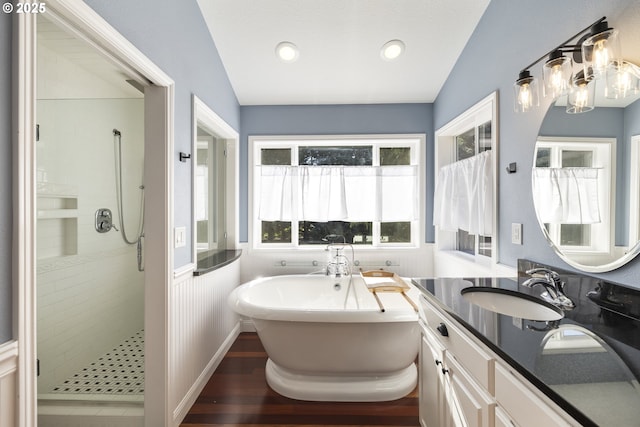 16405 NE 38th St, Vancouver, WA 98682 - full bathroom with a freestanding bath, a shower stall, vanity, wood finished floors, and a chandelier