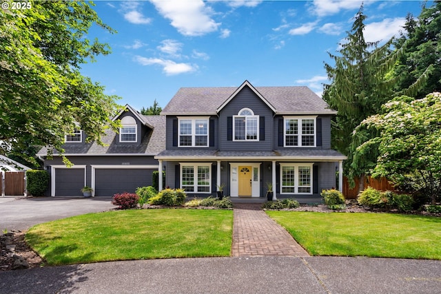 16405 NE 38th St, Vancouver, WA 98682 - view of front facade with asphalt driveway, roof with shingles, an attached garage, and covered porch