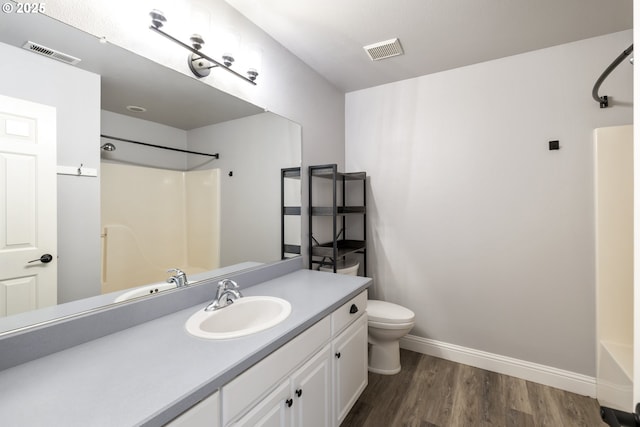 16405 NE 38th St, Vancouver, WA 98682 - full bath with toilet, vanity, wood finished floors, baseboards, and bathtub / shower combination