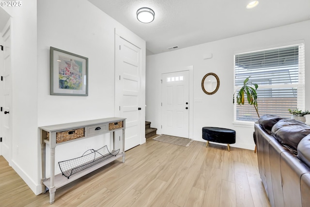 1723 Dotie Dr, Springfield, OR 97477 - entryway featuring light wood-style flooring, baseboards, stairway, and recessed lighting