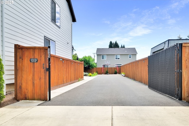 view of home's exterior featuring a gate and fence