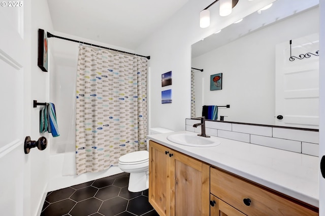 full bathroom with toilet, tile patterned floors, vanity, and shower / bathtub combination with curtain