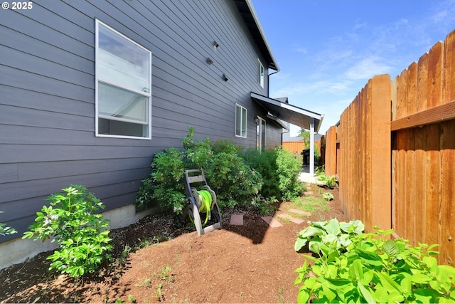 view of property exterior with fence