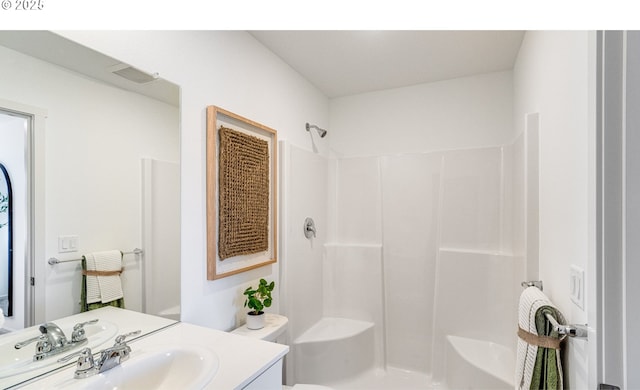 full bath with toilet, walk in shower, vanity, and visible vents
