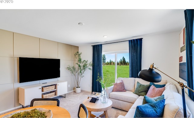 living area with light carpet
