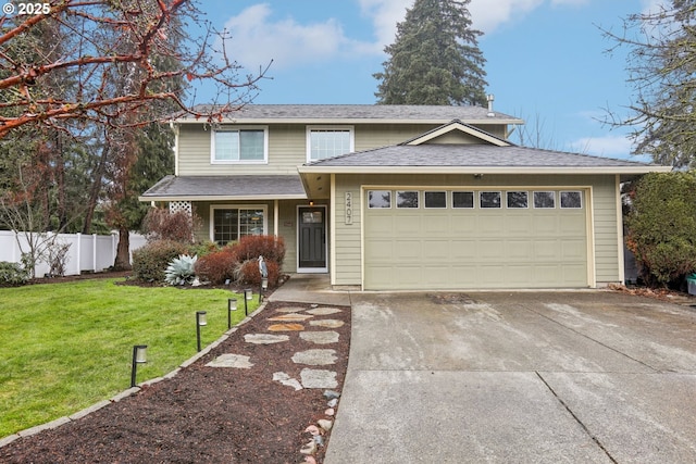 view of front of property with a front yard and a garage