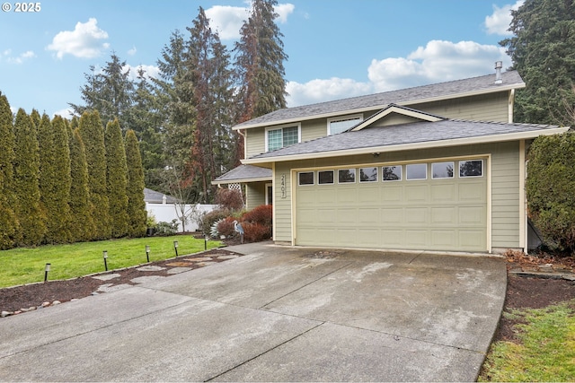 view of front facade with an attached garage, fence, driveway, roof with shingles, and a front lawn