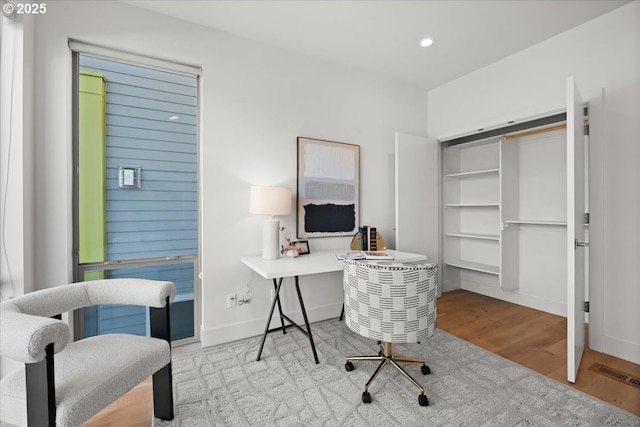 office with recessed lighting, visible vents, baseboards, and wood finished floors