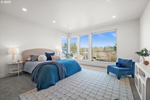 carpeted bedroom featuring baseboards and recessed lighting