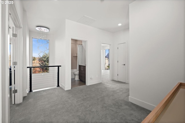 unfurnished bedroom with recessed lighting, carpet flooring, visible vents, and baseboards