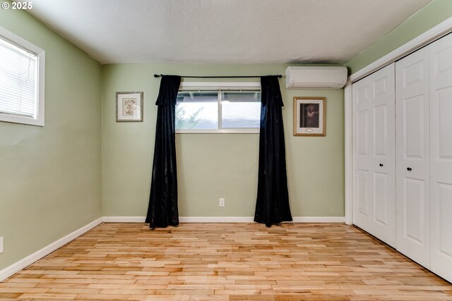 bedroom featuring light hardwood / wood-style floors and a closet