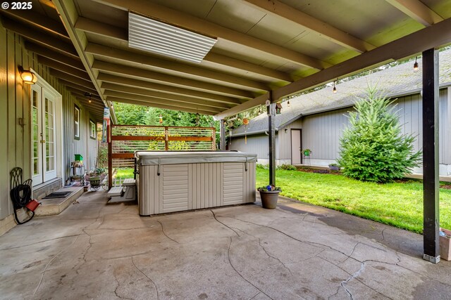 view of patio / terrace with a hot tub