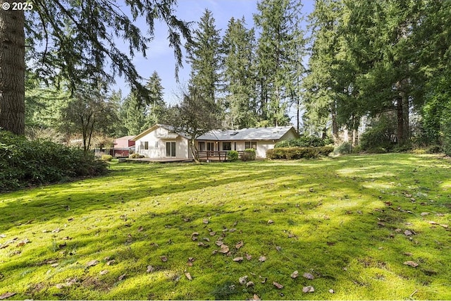 view of yard with a deck