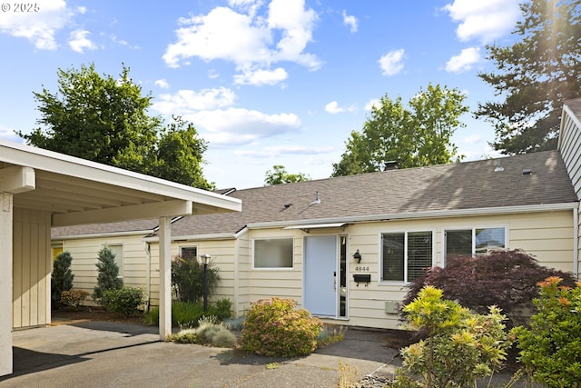 4844 SW Wembley Pl, Beaverton, OR 97005 - view of front of home featuring a shingled roof and an attached carport