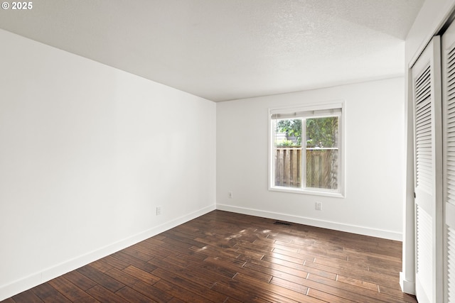 4844 SW Wembley Pl, Beaverton, OR 97005 - unfurnished bedroom with dark wood finished floors and a closet