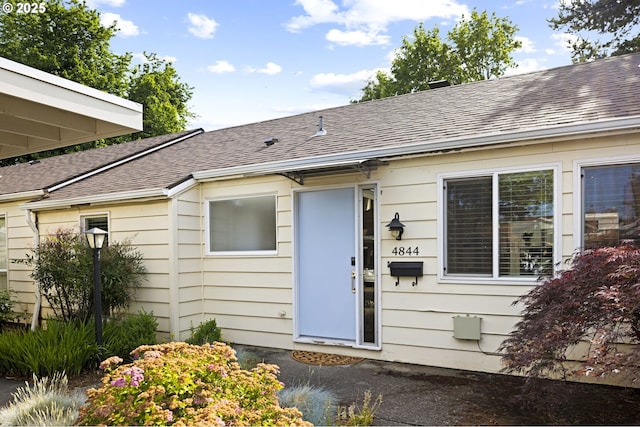4844 SW Wembley Pl, Beaverton, OR 97005 - property entrance with a shingled roof