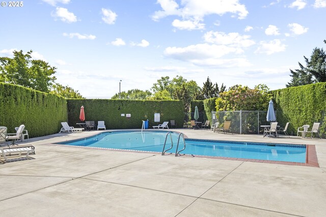 4844 SW Wembley Pl, Beaverton, OR 97005 - community pool featuring a patio and a fenced backyard