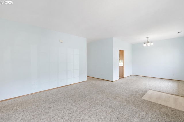 16917 SE Dunhill Loop, Damascus, OR 97089 - empty room featuring a chandelier and carpet flooring
