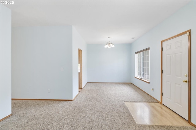16917 SE Dunhill Loop, Damascus, OR 97089 - spare room with a chandelier and carpet flooring