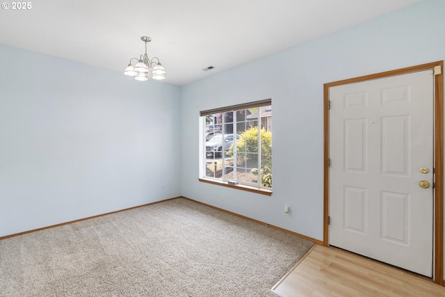 16917 SE Dunhill Loop, Damascus, OR 97089 - empty room featuring a chandelier and light colored carpet
