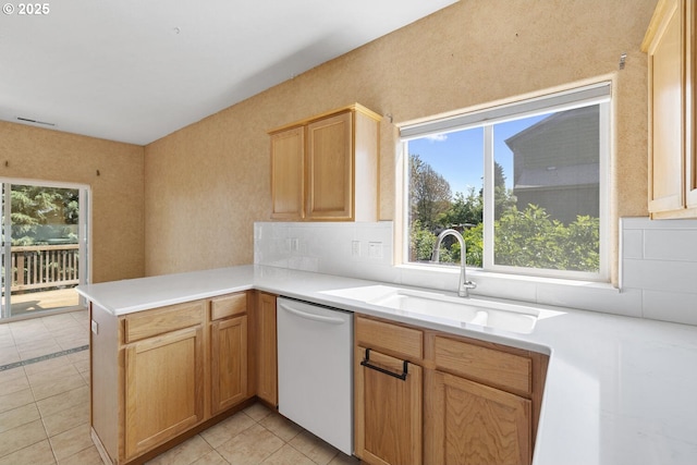 16917 SE Dunhill Loop, Damascus, OR 97089 - kitchen featuring dishwasher, healthy amount of natural light, a peninsula, and backsplash