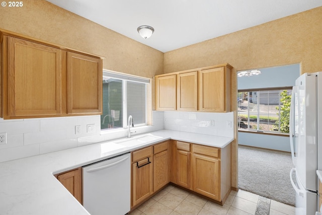 16917 SE Dunhill Loop, Damascus, OR 97089 - kitchen with white appliances, light tile patterned flooring, decorative backsplash, light countertops, and light colored carpet