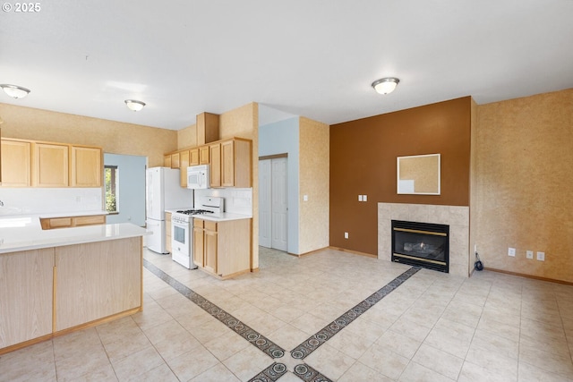 16917 SE Dunhill Loop, Damascus, OR 97089 - kitchen with white appliances, light brown cabinetry, light countertops, and open floor plan