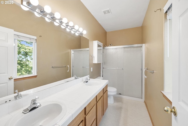 16917 SE Dunhill Loop, Damascus, OR 97089 - full bathroom featuring double vanity, a shower stall, and tile patterned floors