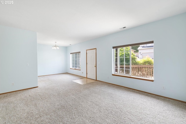 16917 SE Dunhill Loop, Damascus, OR 97089 - spare room with a chandelier and carpet flooring