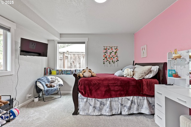 3430 Breezewood Ave, Eugene, OR 97405 - bedroom featuring carpet floors, multiple windows, a textured ceiling, baseboards, and a textured wall