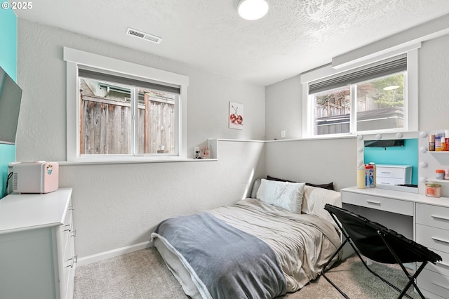 3430 Breezewood Ave, Eugene, OR 97405 - carpeted bedroom featuring a textured ceiling, a textured wall, baseboards, and a desk