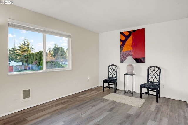 living area with wood-type flooring