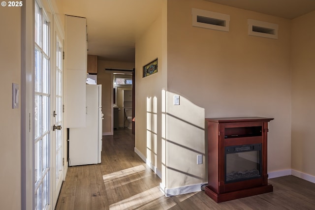 corridor featuring light hardwood / wood-style floors