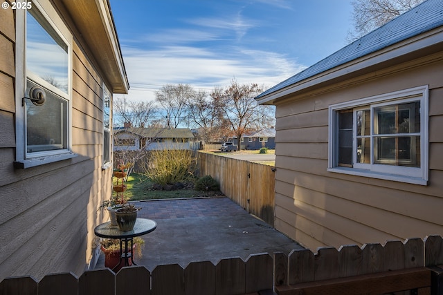 exterior space featuring a patio area and fence