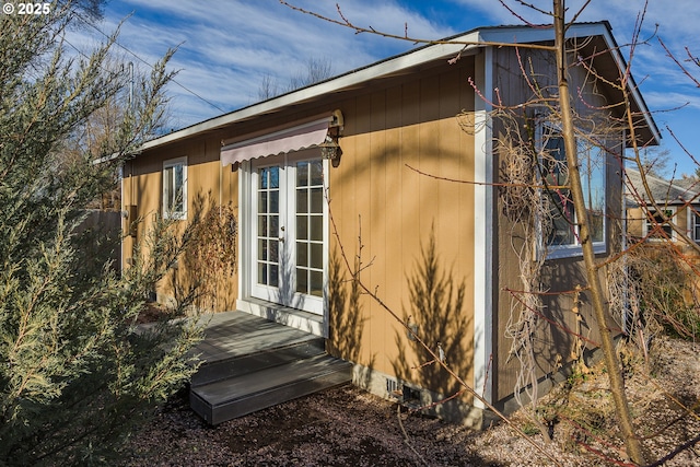 view of side of home featuring french doors