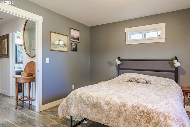 bedroom with wood-type flooring