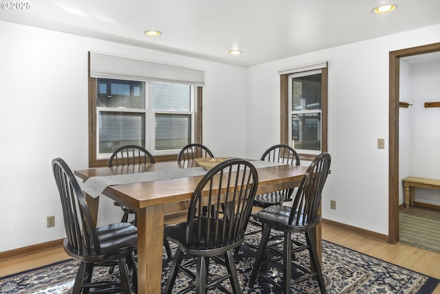 dining area with hardwood / wood-style floors