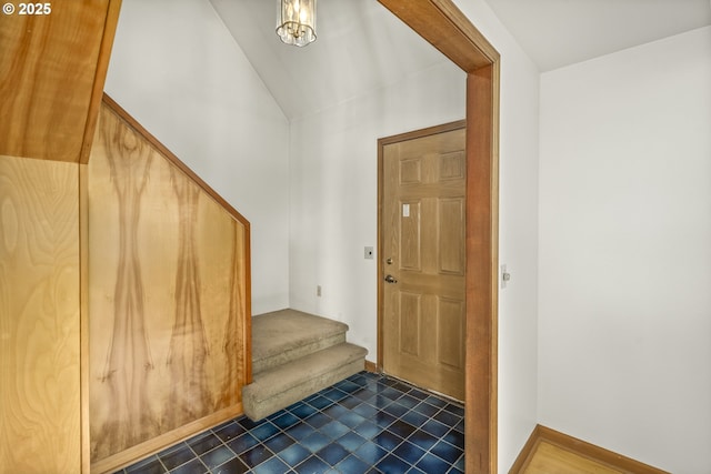 entryway featuring lofted ceiling