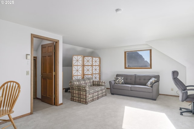 carpeted office space with vaulted ceiling