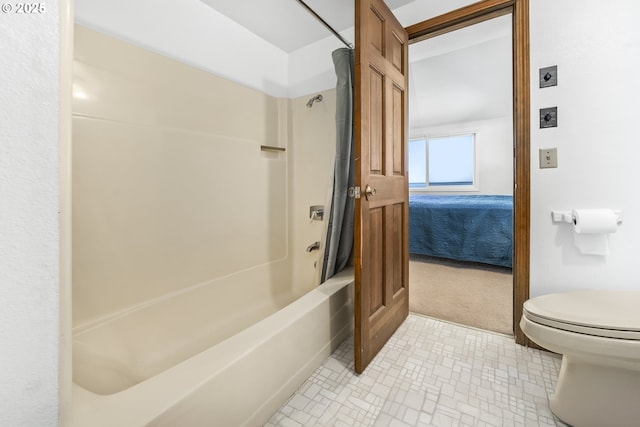 bathroom featuring toilet and shower / bath combo with shower curtain