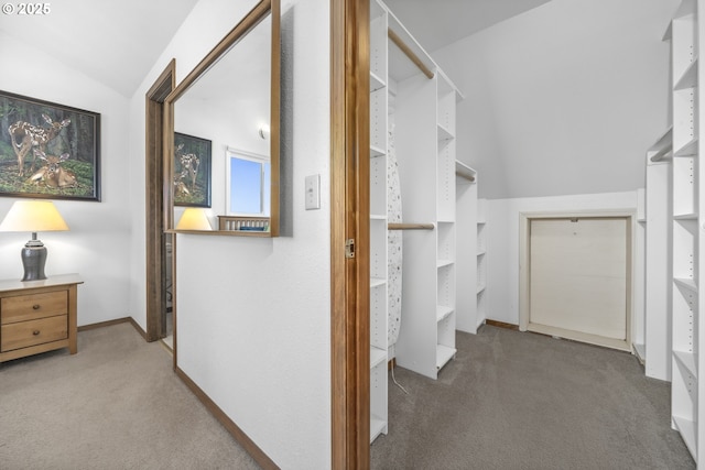 interior space with lofted ceiling and light colored carpet