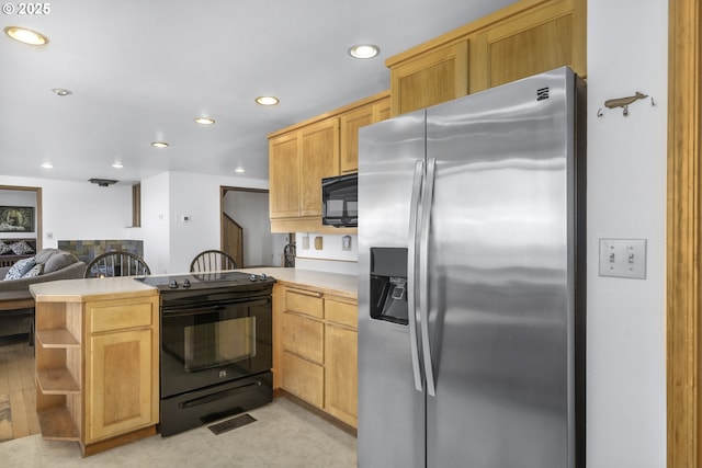 kitchen featuring kitchen peninsula, light brown cabinetry, and black appliances