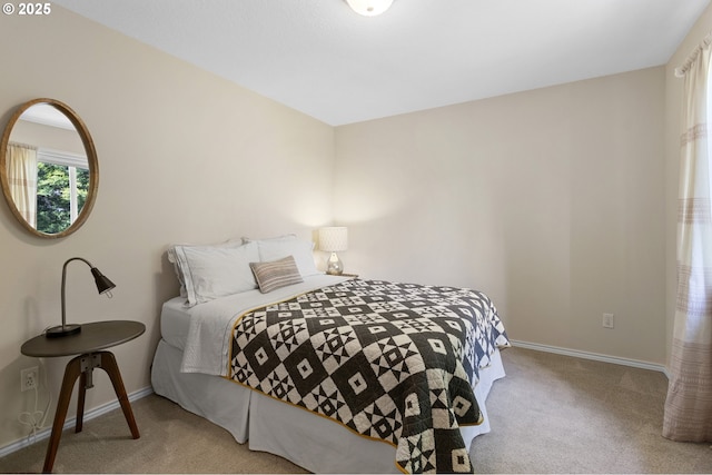 carpeted bedroom with baseboards