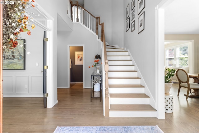staircase featuring wood finished floors